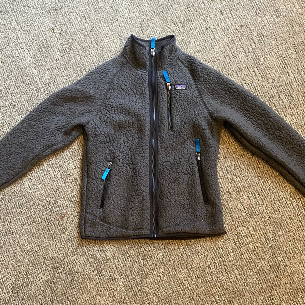 This is youth large dark grey Patagonia jacket.